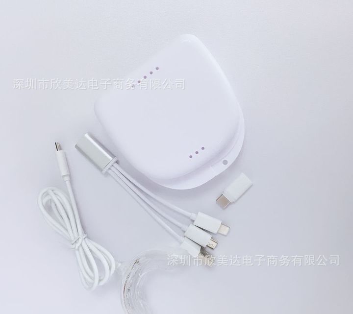 The tray light's storage case beside its cable.