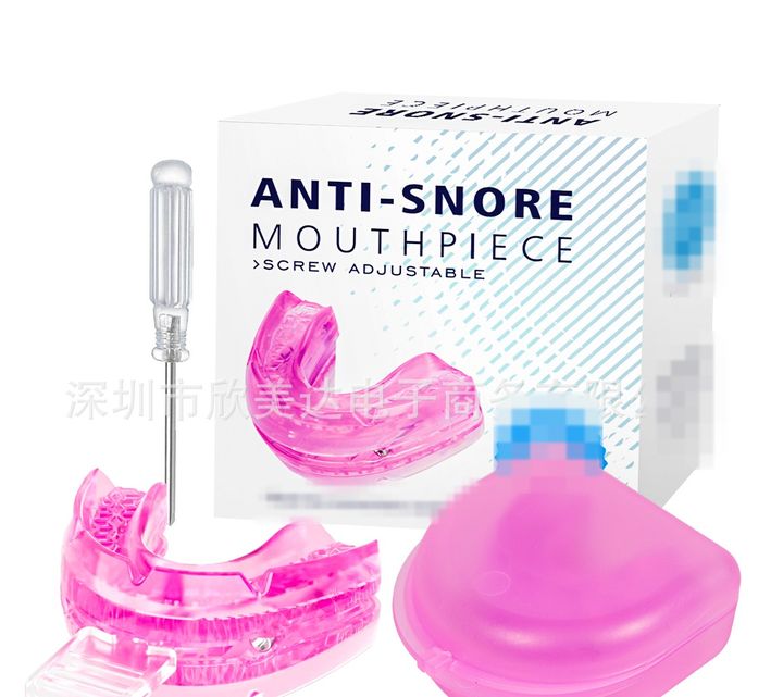 Pink screw-adjustable mouthpiece with its fitting tool and a pink storage case, box behind.