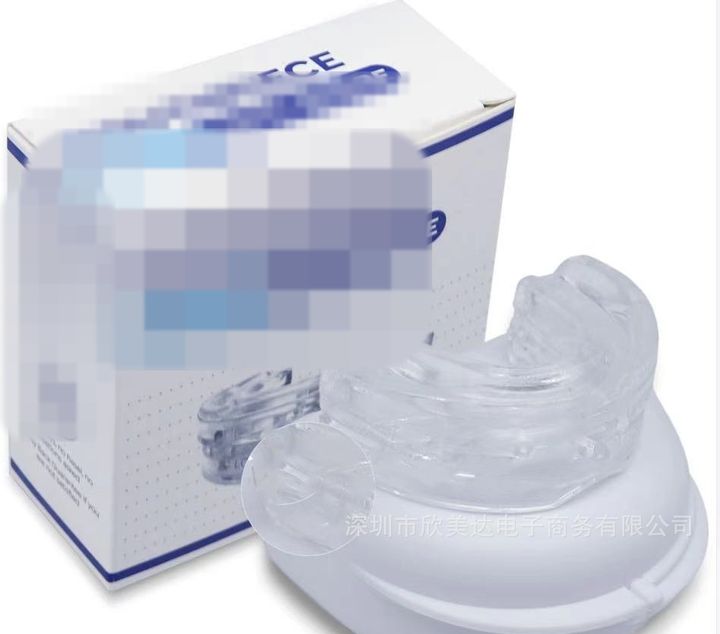 Clear anti-snoring mouthpiece on its case beside the retail box.