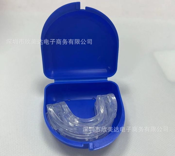 Clear mouthpiece inside an open blue vented storage case.