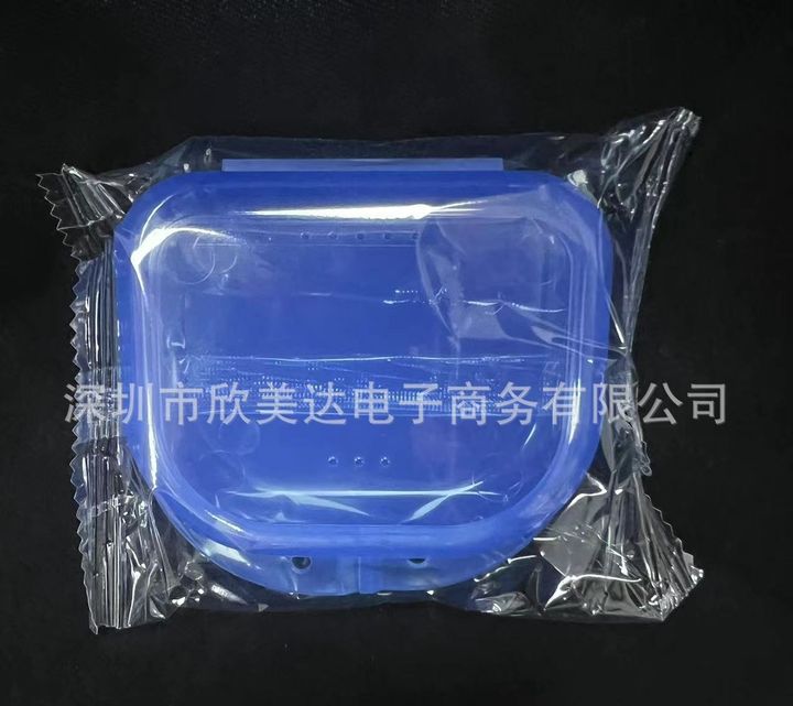 A blue vented storage case sealed in a polybag.