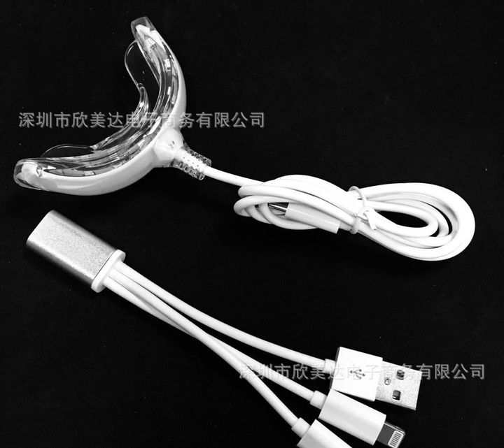 16-LED whitening tray light with its three-way cable.