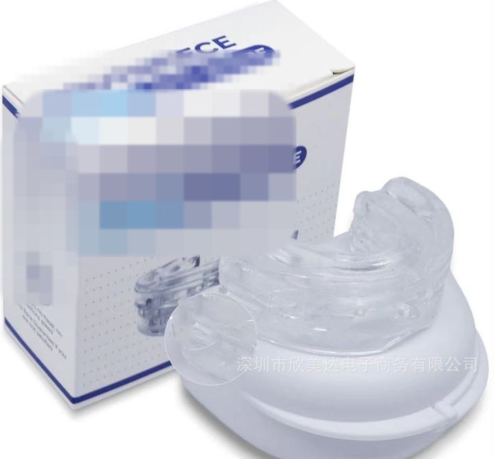 Clear adjustable mouthpiece on its case beside the retail box.