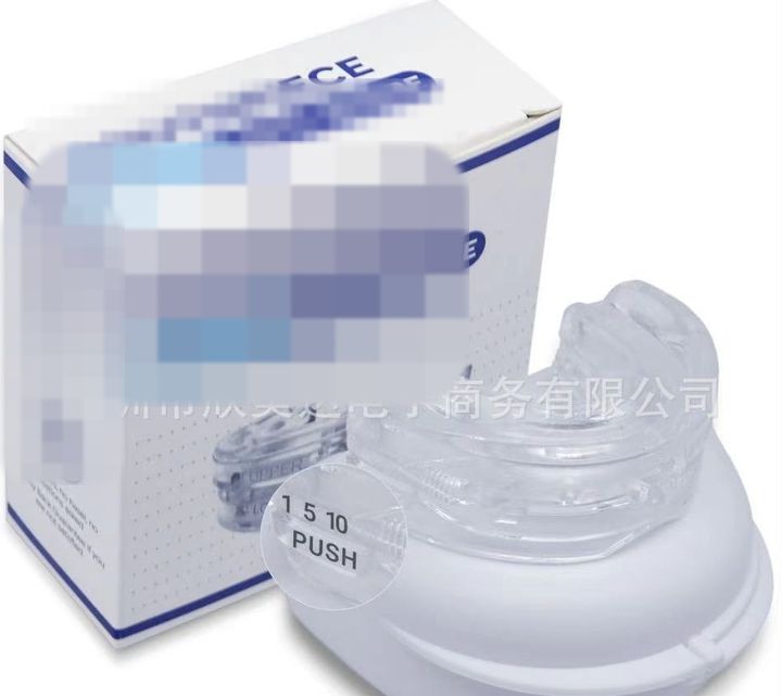 Clear adjustable mouthpiece on its case beside the retail box.