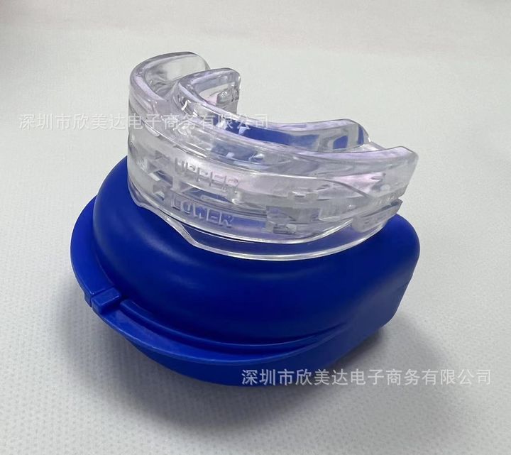 Clear mouthpiece inside an open blue vented case.