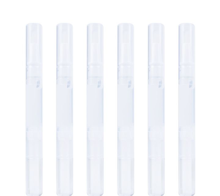 Whitening pens with their caps on.