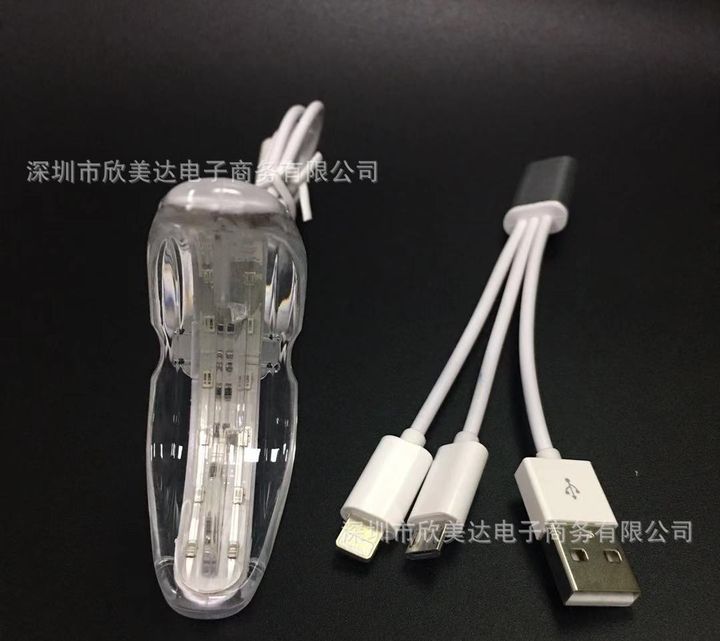 The tray light's LED unit beside its three-way adapter cable.
