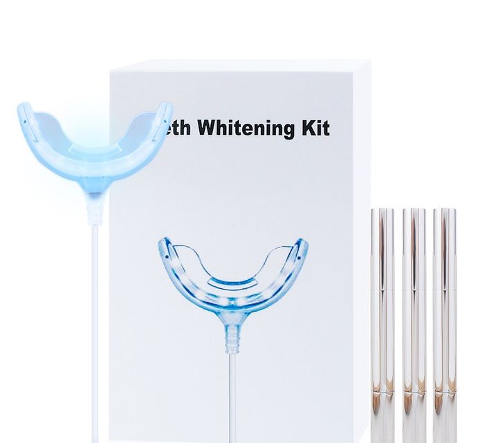 Whitening kit with its box, LED tray and three silver pens.