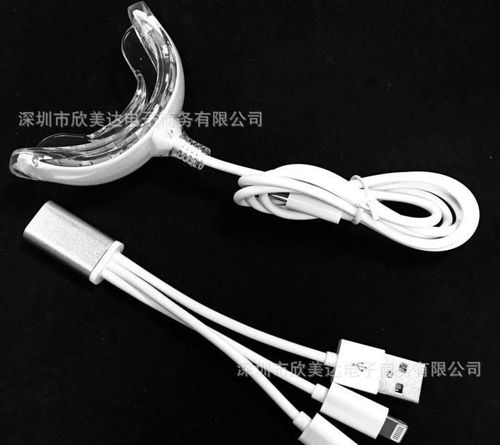 16-LED whitening tray light with its three-way cable.