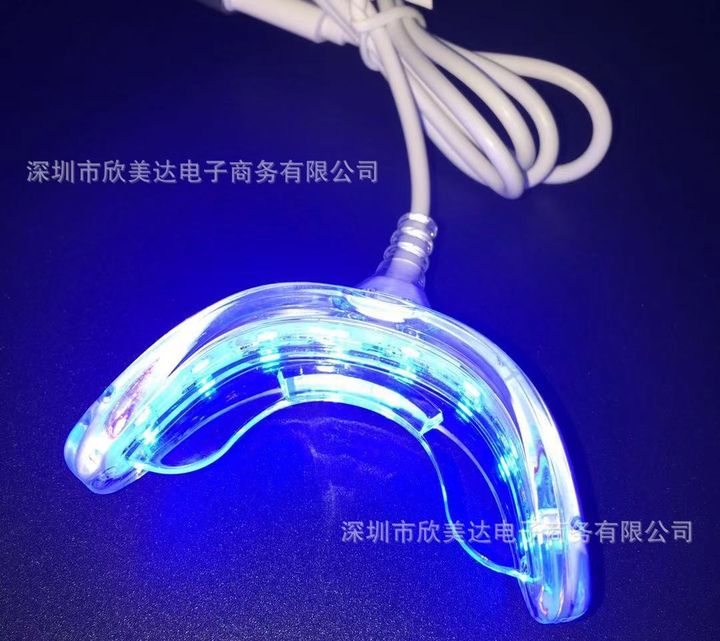 16-LED whitening tray light switched on, blue.